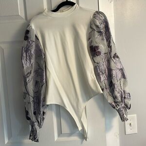 Flat White body suit with purple floral puff sleeves NWT